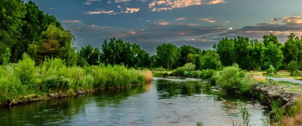Creek and prairie landscape representing the Blue Prairie Initiative